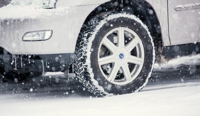How can I rent a car equipped with studless snow tires in Japan?